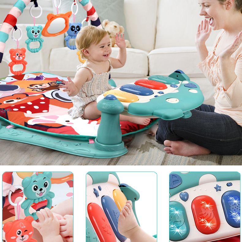 Educational mat for babies with a piano - green