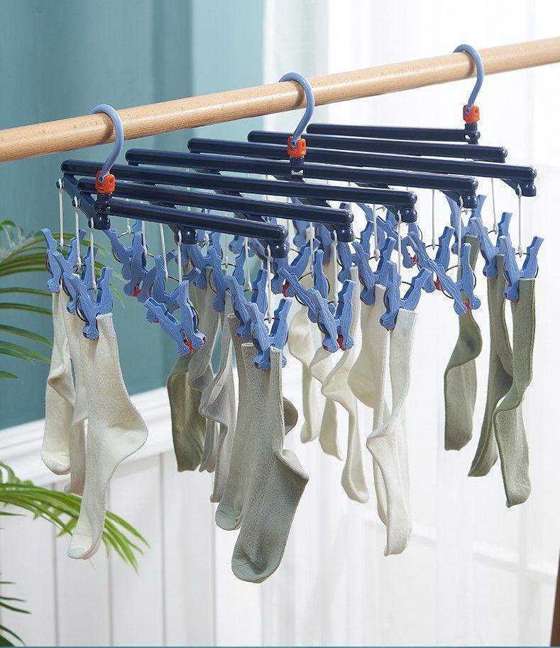 Plastikowy składany wieszak na ubrania z klipsami – 29 klipsów - jasnoniebieski
