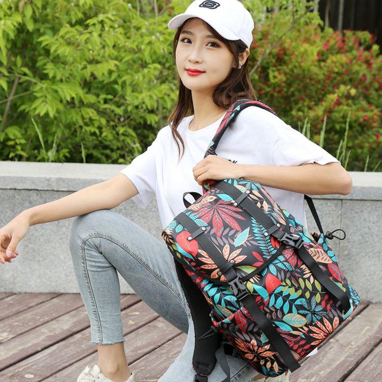 Travel backpack with space for a laptop - colourful leaves