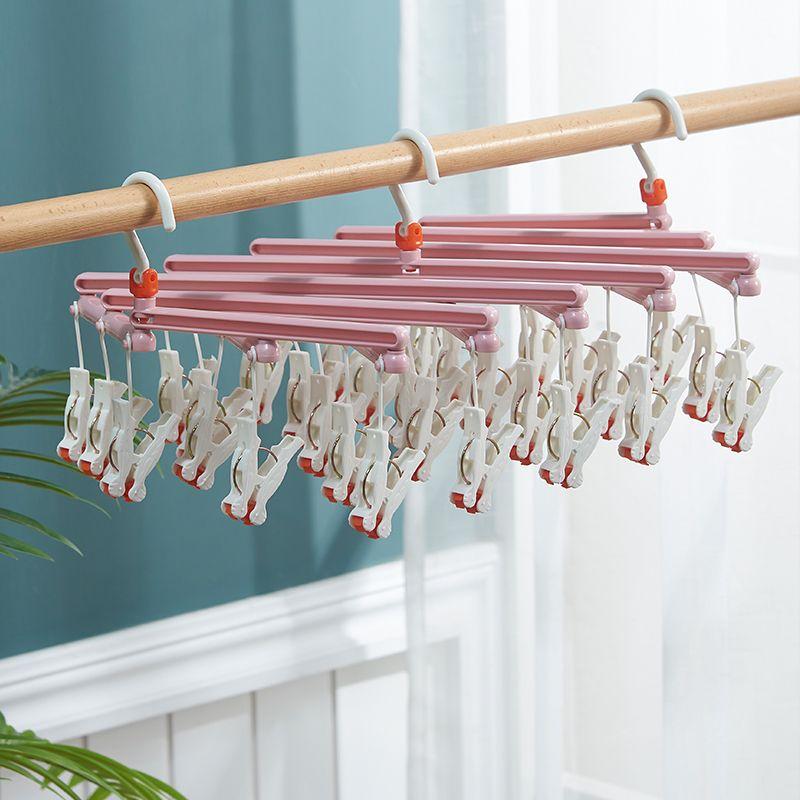 Plastikowy składany wieszak na ubrania z klipsami – 14 klipsów - różowy