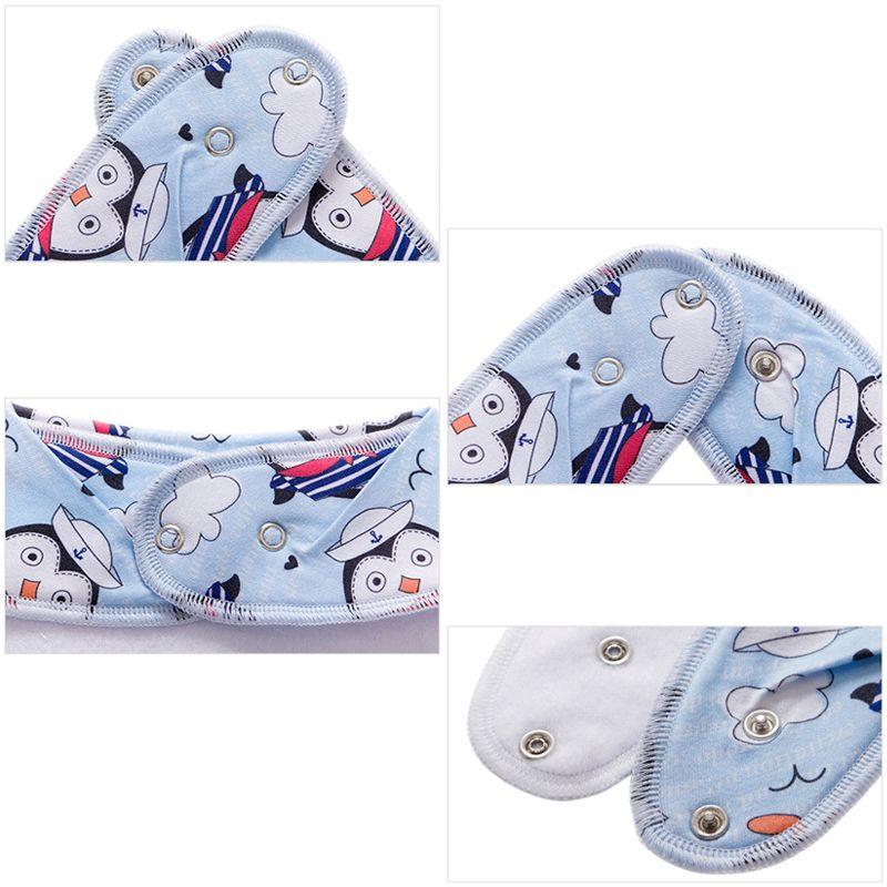 Scarf / bib with a pacifier hanger - cross