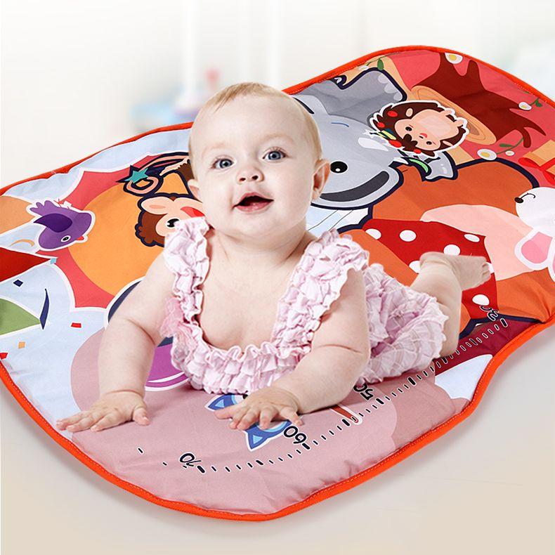 Educational mat for babies with a piano - orange