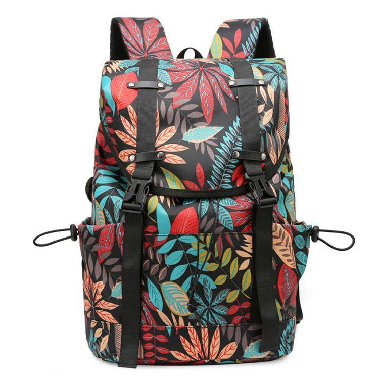 Travel backpack with space for a laptop - colourful leaves