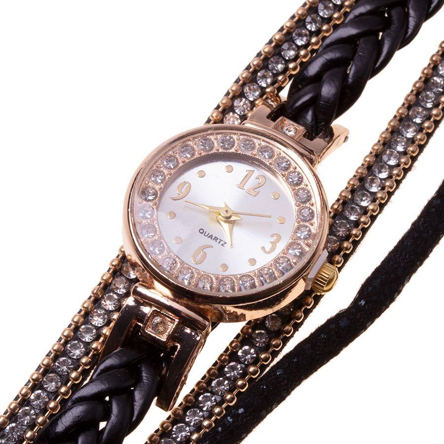 Gold watch with a black bracelet, strap wrapped