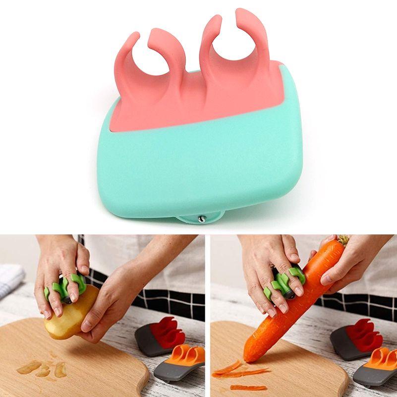 Vegetable and fruit peeler with finger grip - green-pink