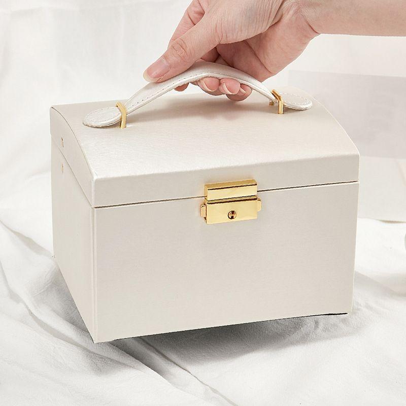 A multi-level casket, a jewelery box - beige