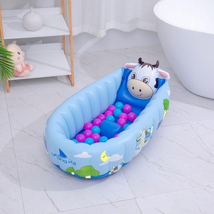 Inflatable baby bathtub with balls - shape of a cow